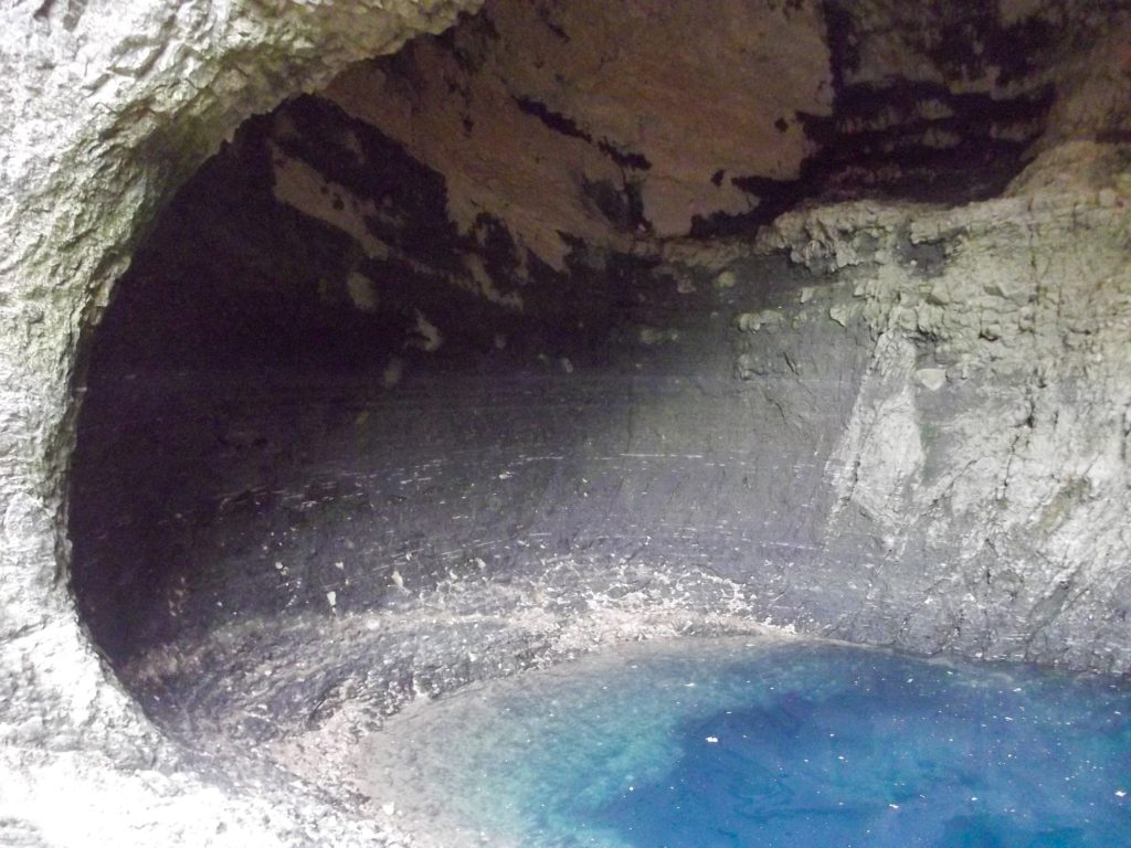 A blue pool inside a French cave.