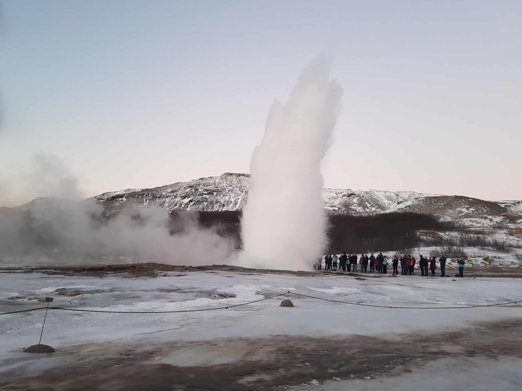 A bloom of water vapour erupts into the air from the famous Strokkur geysir.