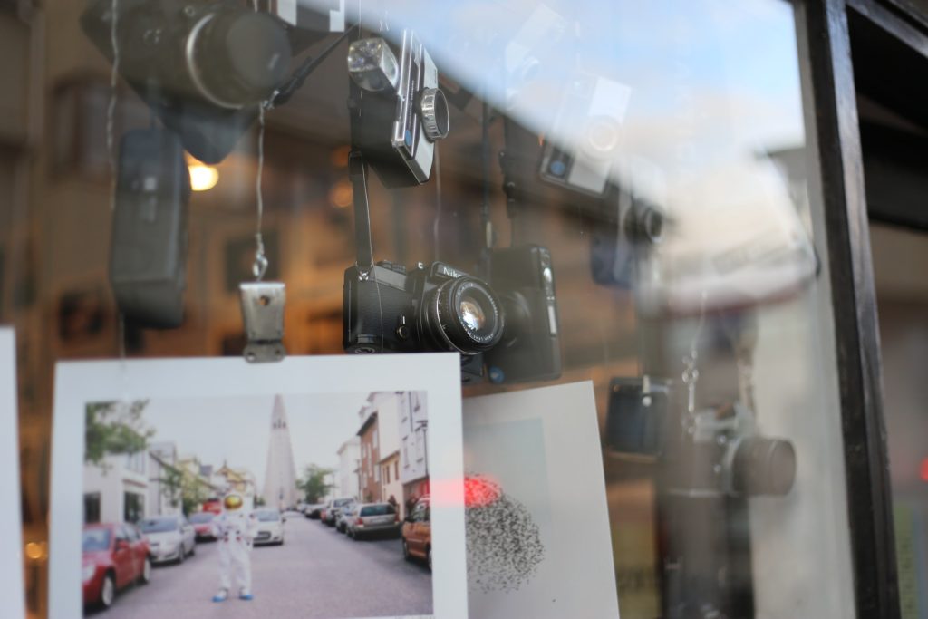 Cameras in a window with a picture of Hallgrímskirkja.
