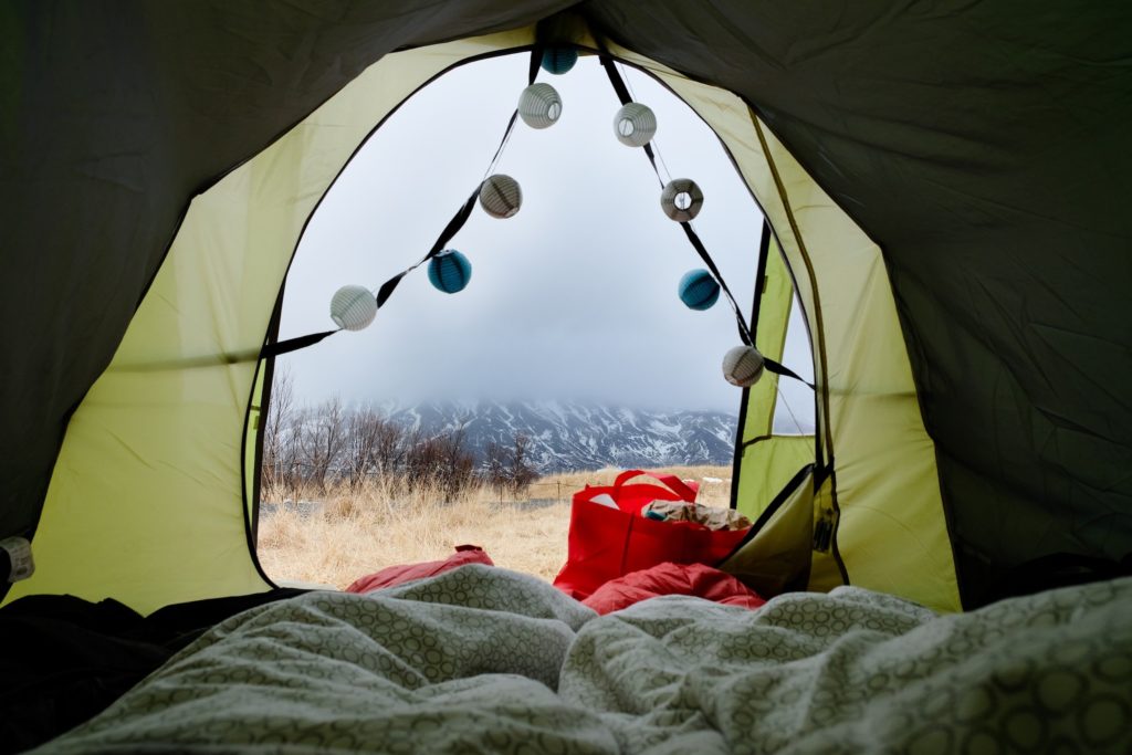 POV: You open your tent and look out at icy mountains.