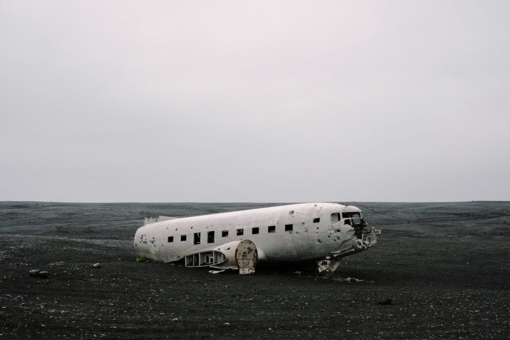 An old plane wreck from 1973 stands alone in the Icelandic landscape.