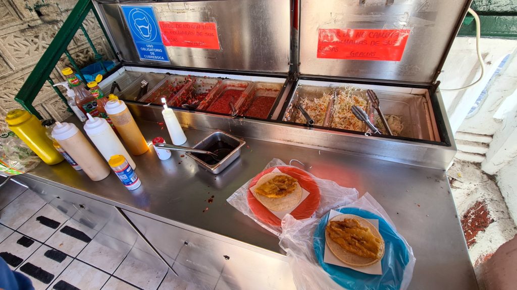 Freshly fried fish tacos are a stable of El Estadio. You can choose your own dips and toppings at the sauces station.