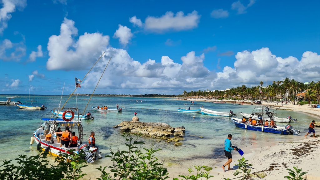 Several boats full of tourists prepared to head out into Akumal bay.