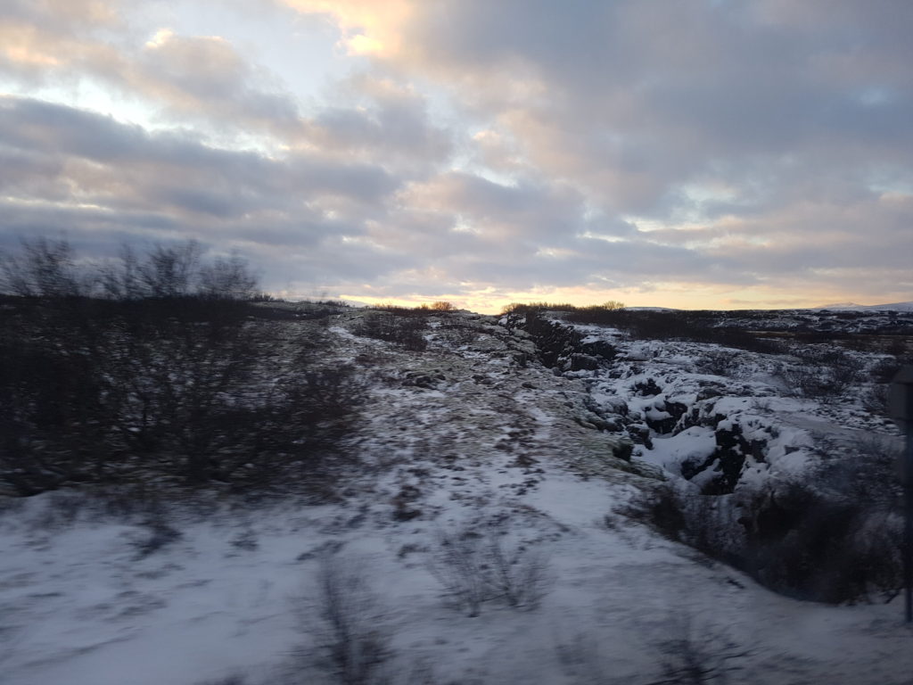A snowy scene races by as the sun rises.