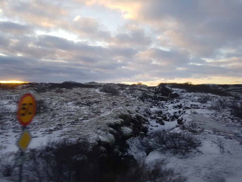 A frozen rocky landscape races by.