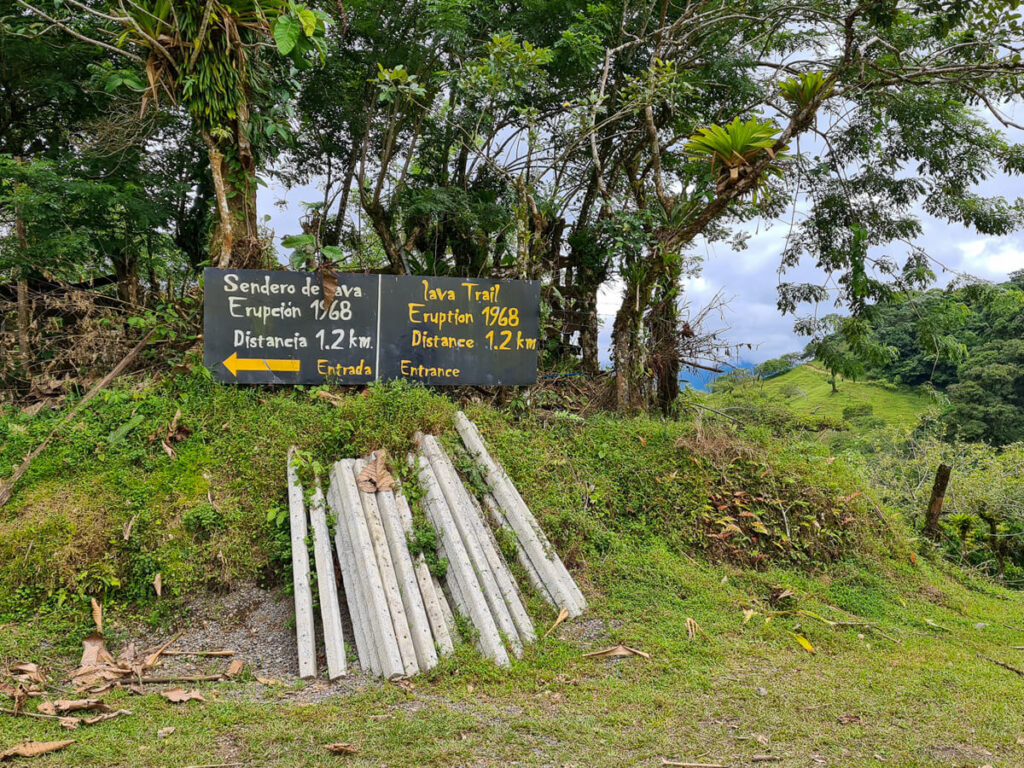 Signs to the 1968 Lava Flow Trail and the 1968 Private Reserve at Arenal Volcano.