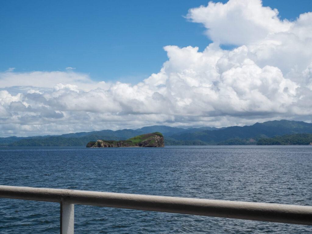 A island off the Nicoya Peninsula, Costa Rica, as viewed from a boat.