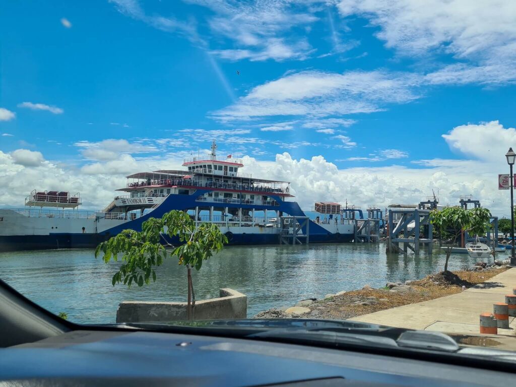 A large ferry sits docked in a harbour in Costa Rica.