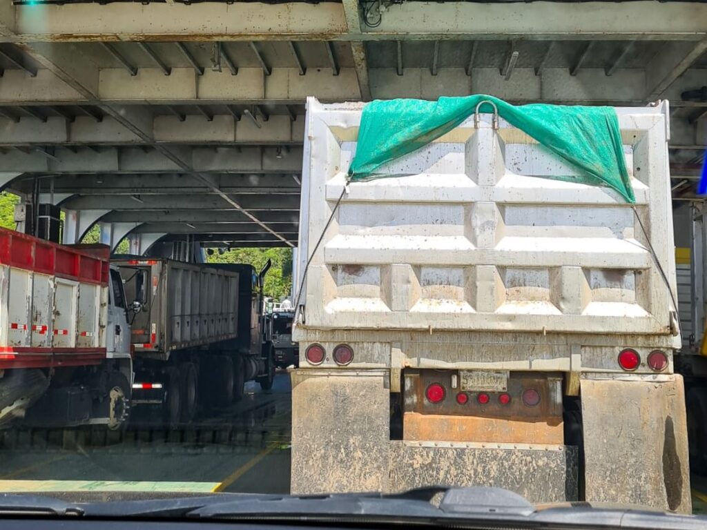 A large lorry waiting to exit a ferry in Costa Rica.