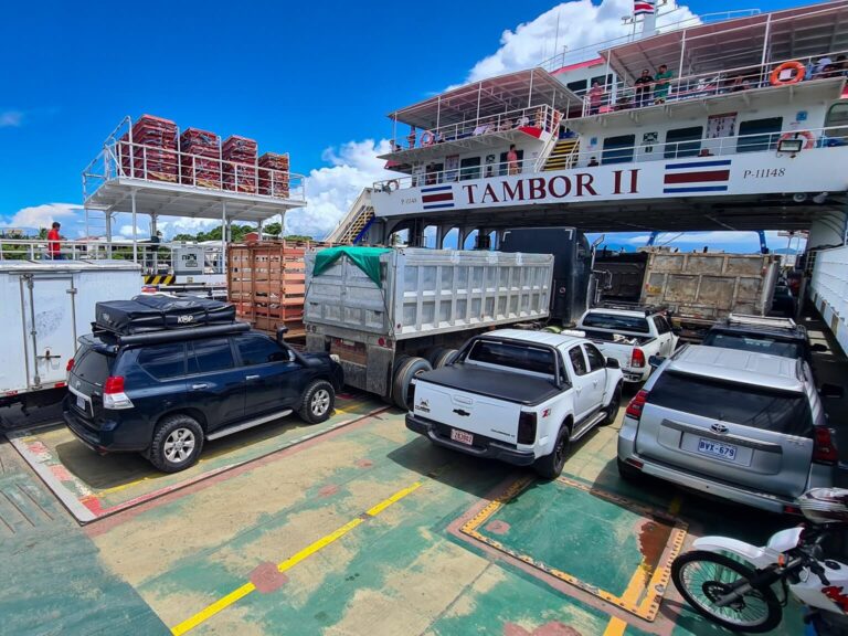 A ferry loaded with vehicles ready for travel.