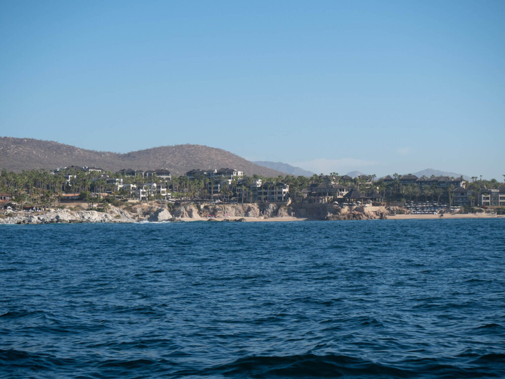 A view of a seaside hotels in Cabo from the ocean.