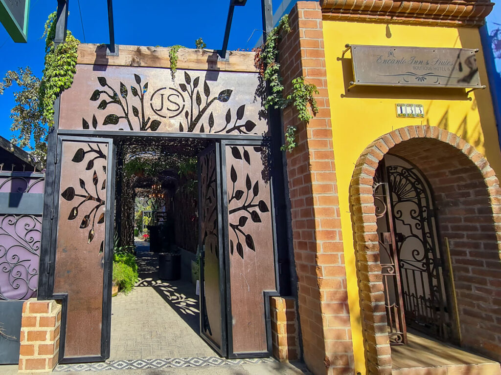 The wooden archway entrance to The Secret Garden Restaurant in San José del Cabo.