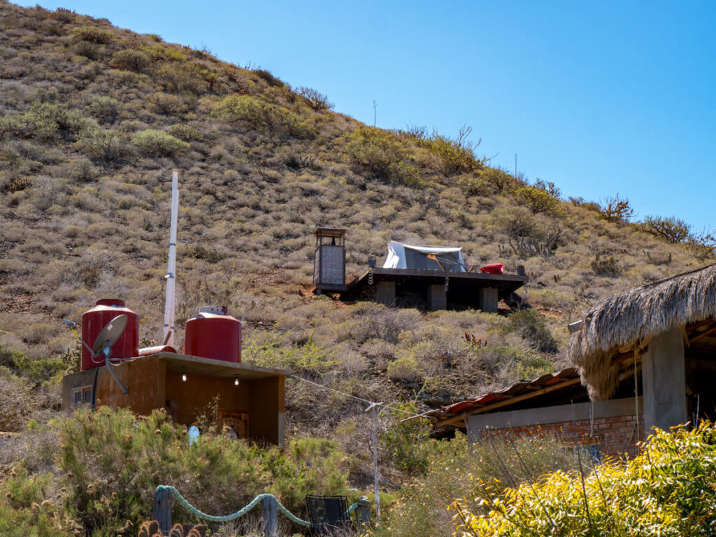 A view of one of the glamping tents at Magdalena Bay Whales Camp looking up from the beach.