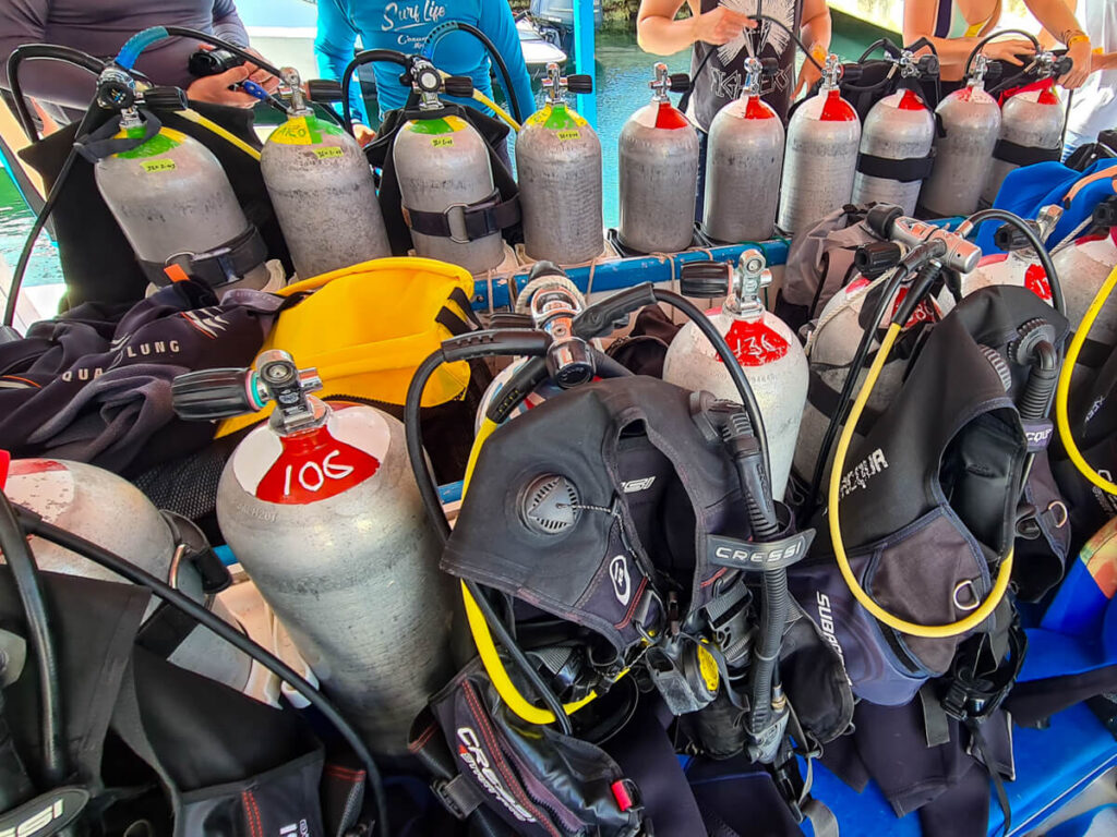 SCUBA diving tanks and BCDs on a boat near Cozumel.