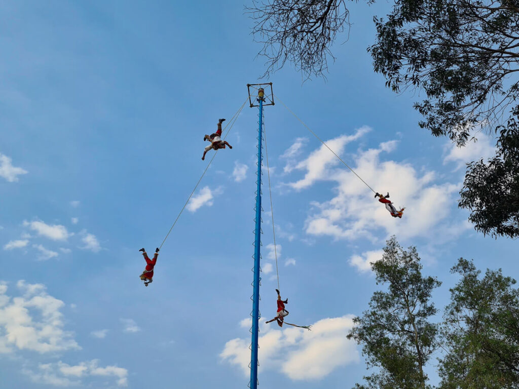Danza de Los Voladores - the famous acrobatic performers hanging from a pole in Mexico.
