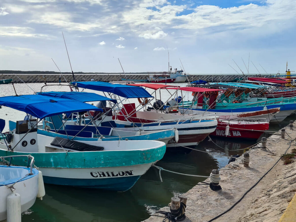 Traditional boats called pangas docked at a pier on Isla Holbox.