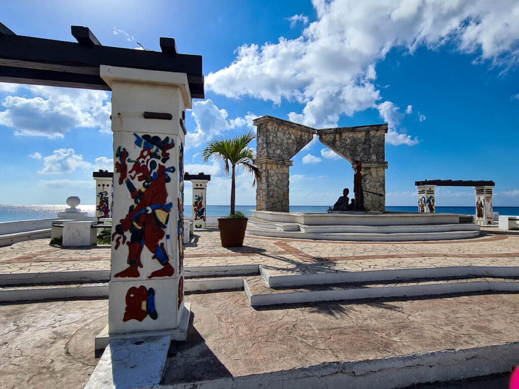 Monuments depicting Maya people on the malecĂłn in Cozumel.