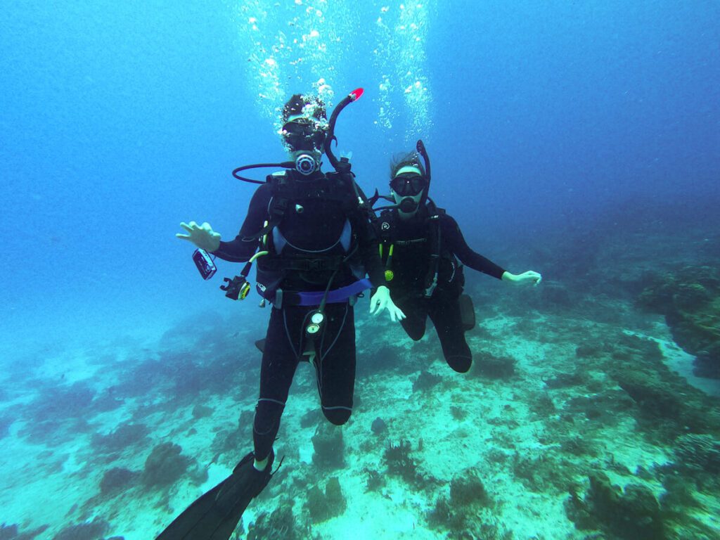Lucy and Dan SCUBA diving in the clear waters off Isla Cozumel.