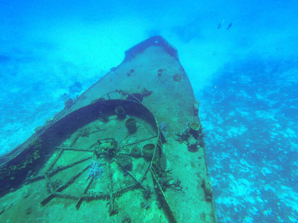 The front of a large shipwreck underwater near Isla Cozumel.