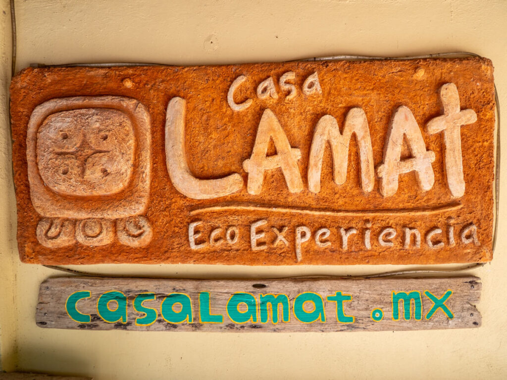 A sign that reads "Casa Lamat Eco Experiencia" followed by "casalamat.mx".