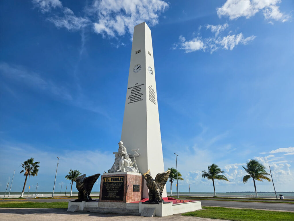 A tall clock tower, a monument in Chetumal, Mexico.