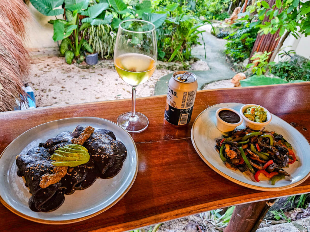 Fresh, tortillas, refried beans, avocado, and a selection of vegetables, all served at the Casa Lamat restaurant.