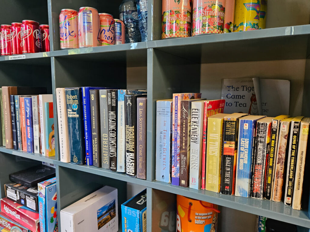 A few shelves of books making up the free book exchange at Belizean Shores Resort.