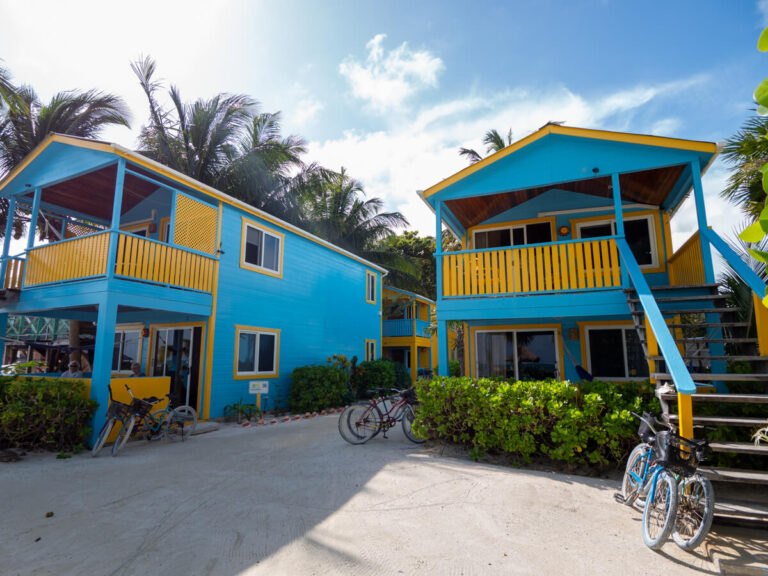 A small collection of brightly-coloured units that make up Colinda Cabanas, a highly-rated accommodation in Caye Caulker.