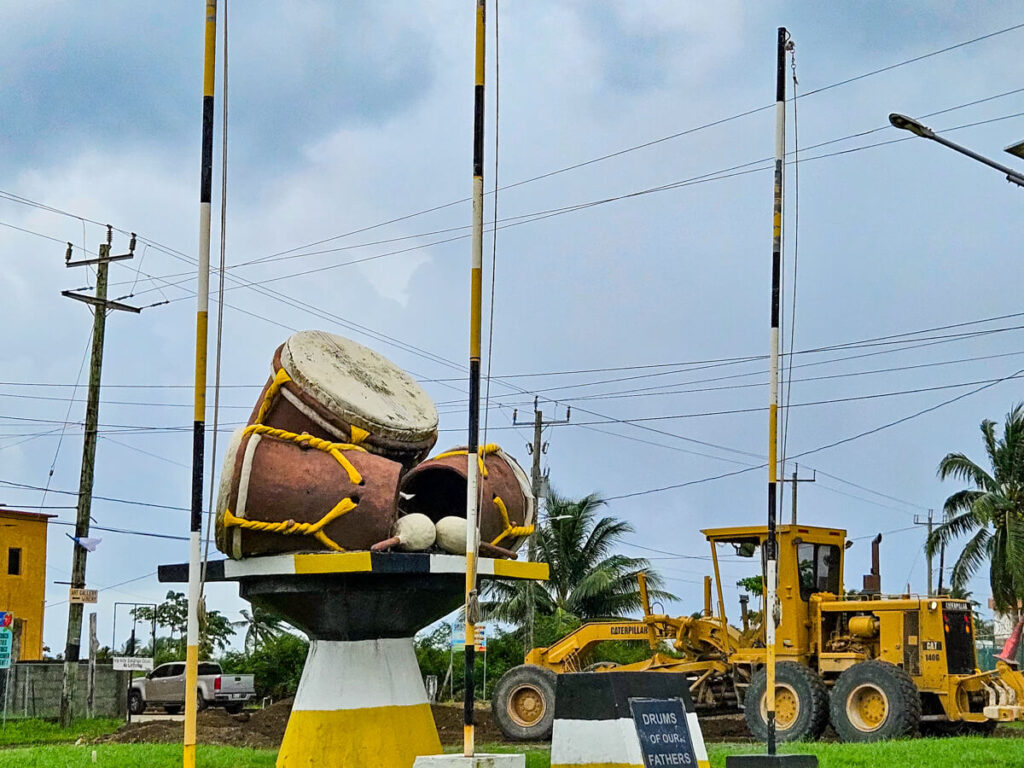 The three drums of the Our Fathers Monument in the middle of a roundabout in Dangriga.