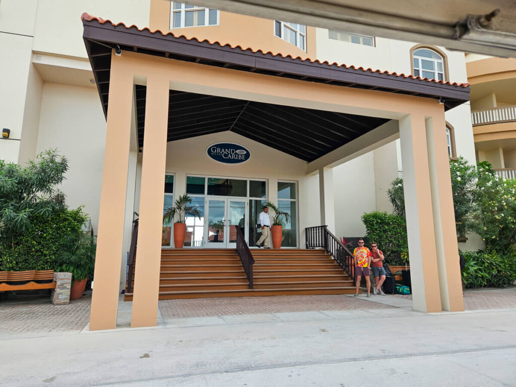 The lavish entrance to the Grand Caribe Hotel in San Pedro, Belize. An attendant waits to greet guests and welcome them into the hotel.