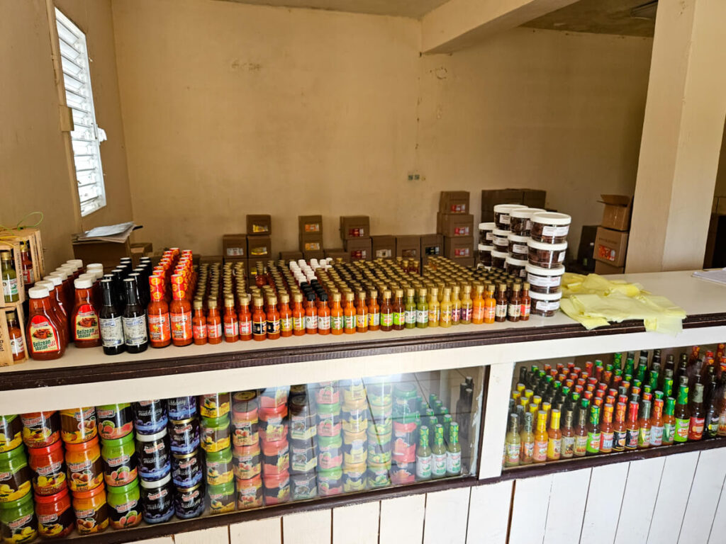 Marie Sharp's Hot Sauces lined up in the store in Dangriga.
