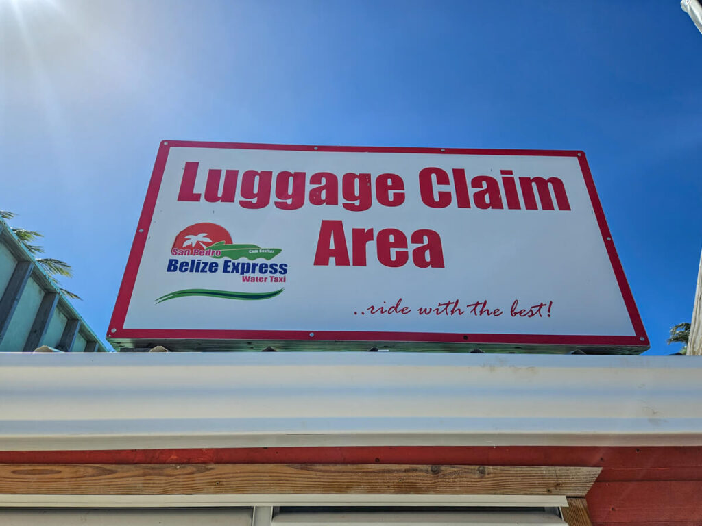 A sign dictating the Luggage Claim Area for the San Pedro Belize Express Water Taxi.