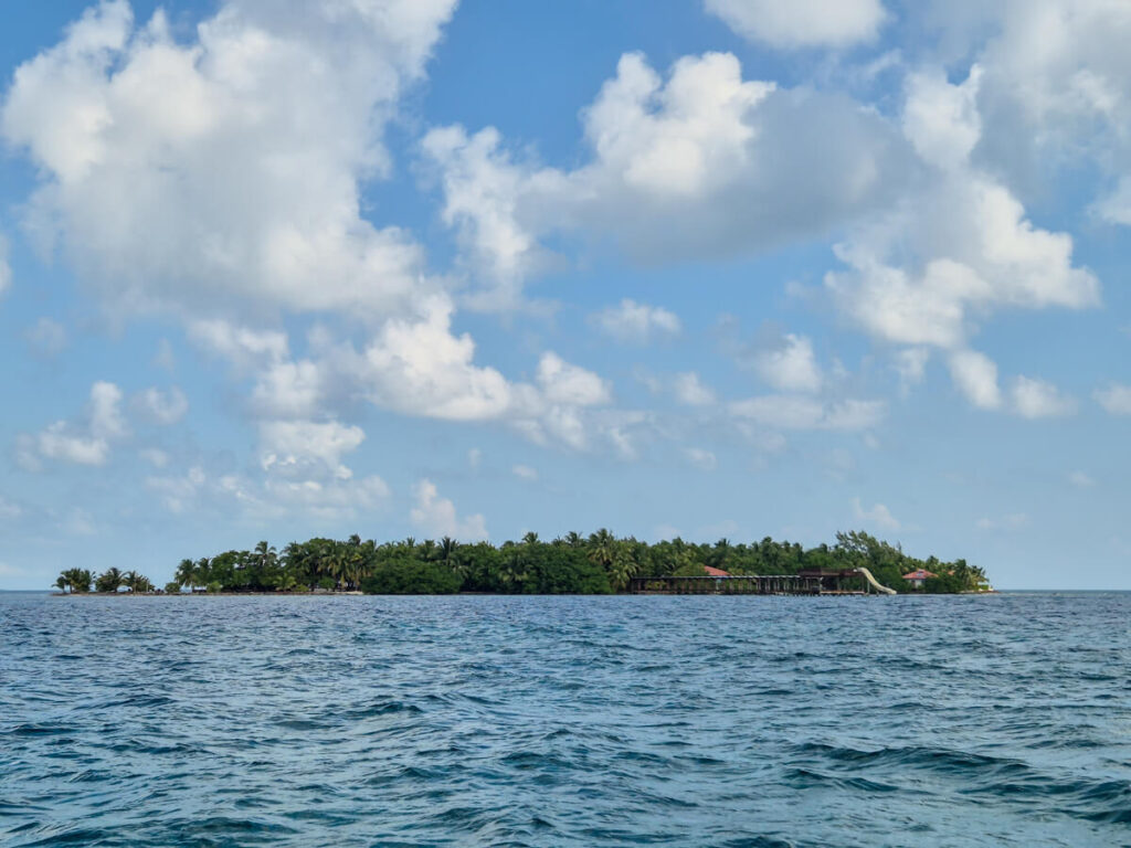 Ray Caye, a luxury, island resort in Belize that is sustainability focused, and has a large slide from the coast that goes right into the sea.