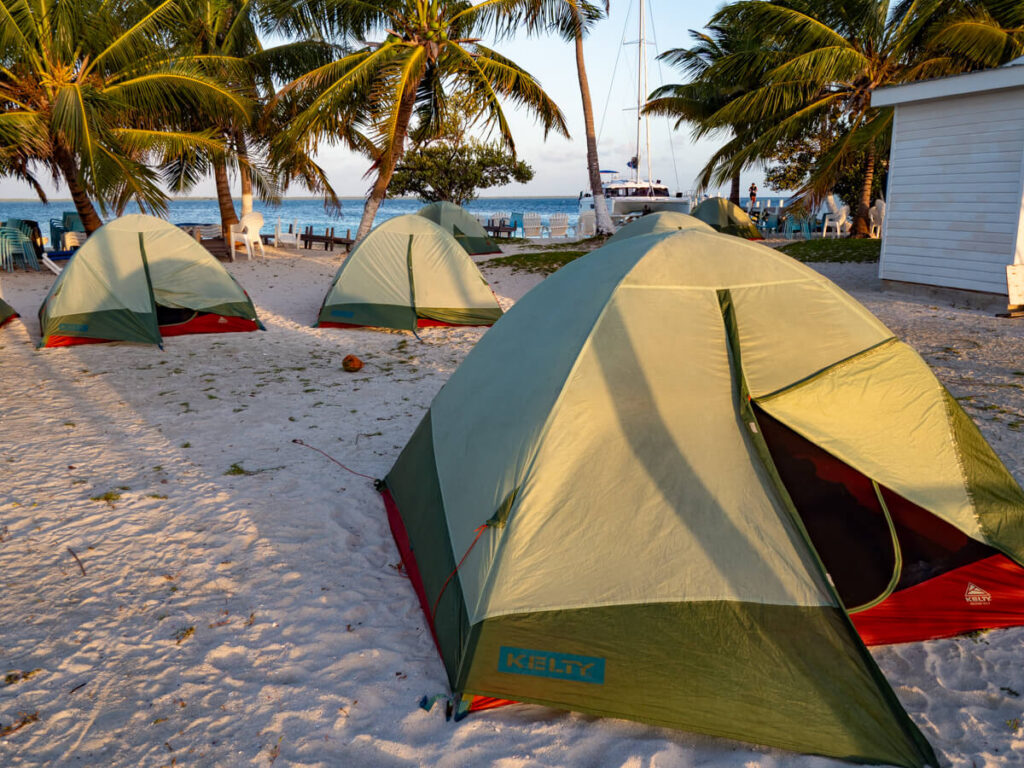 A handful of tents set up on Rendezvous Caye. These tents are for tourists on an overnight sailing trip in Belize with Ragga Sailing Adventures.