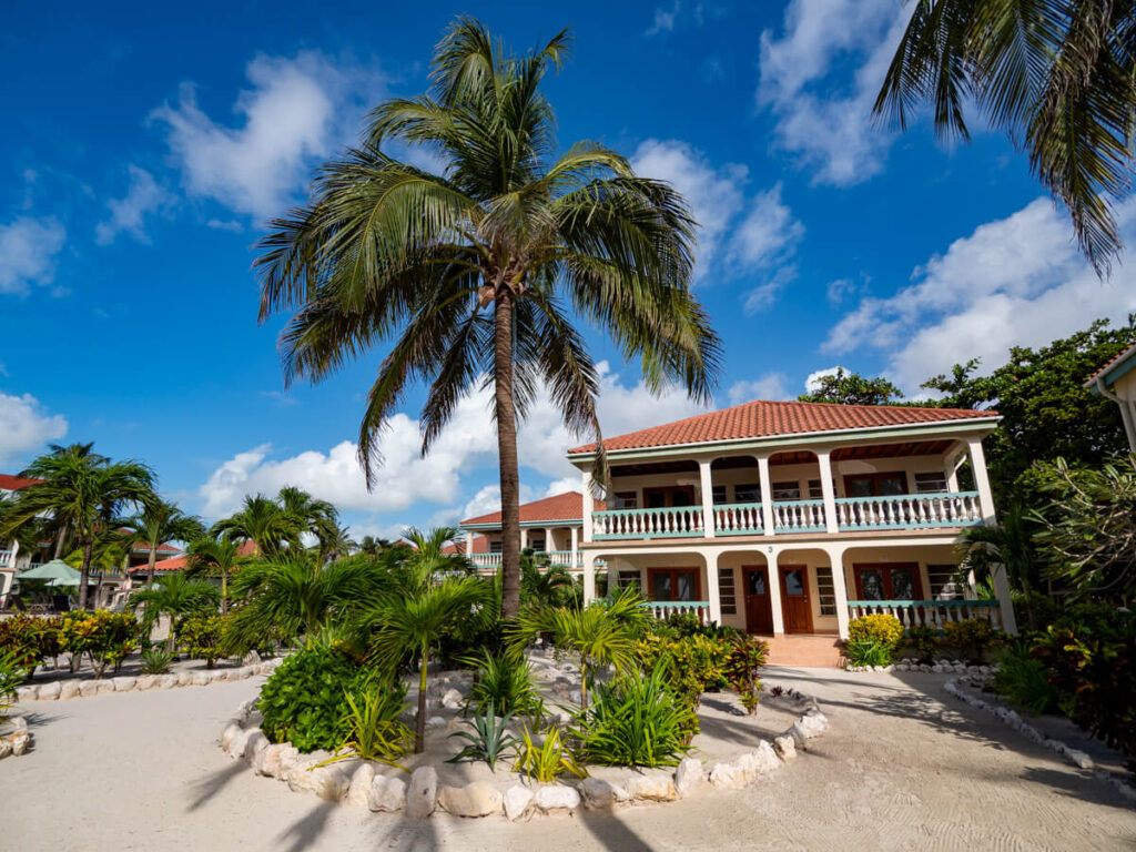 The suites at Belizean Shores Resort as viewed from the outside. The property is surrounded by greenery.