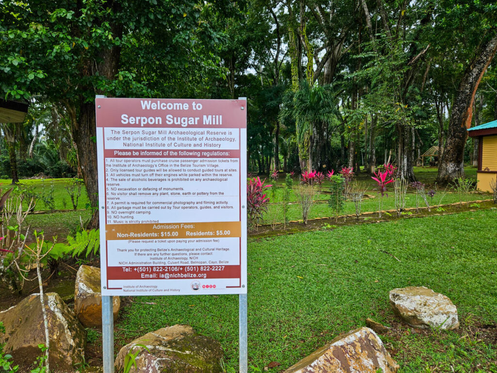 A sign dictating the rules and regulations for visitors to Serpon Sugar Mill in Belize.