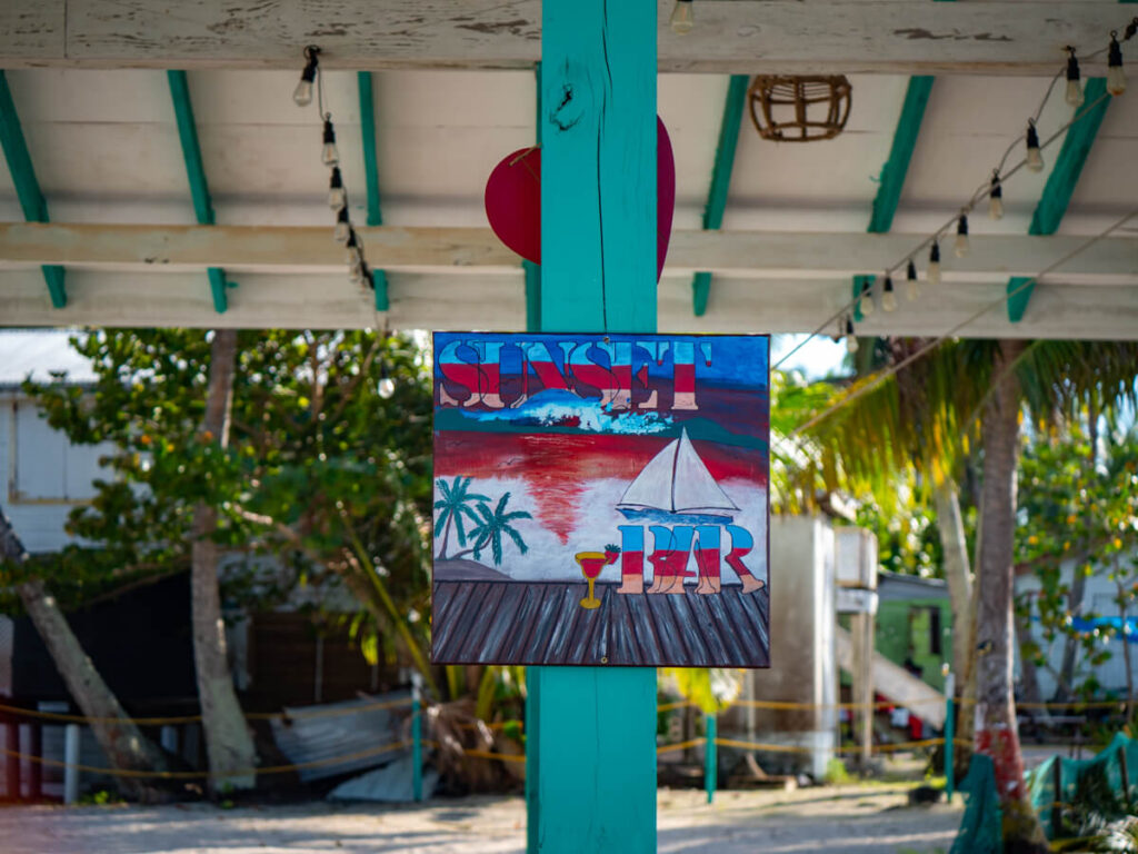 A sign for the Sunset Bar on Tobacco Caye.