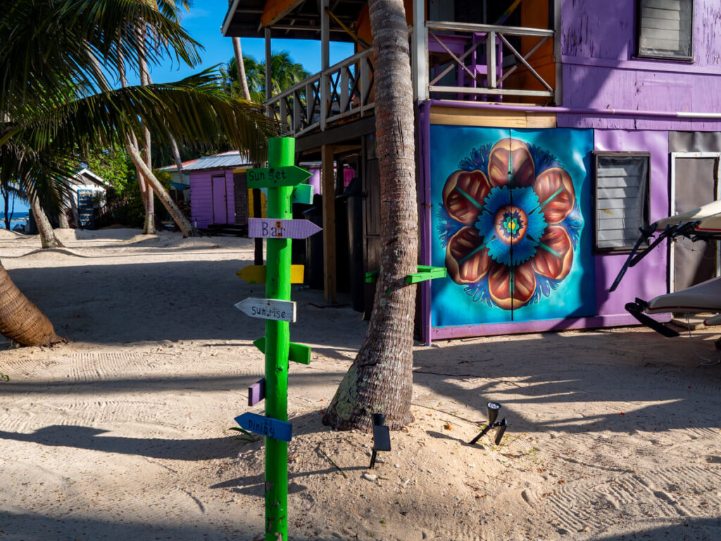 A post on Tobacco Caye with arrows pointing to "Sunset", "Bar", "Sunrise", and "Dining".