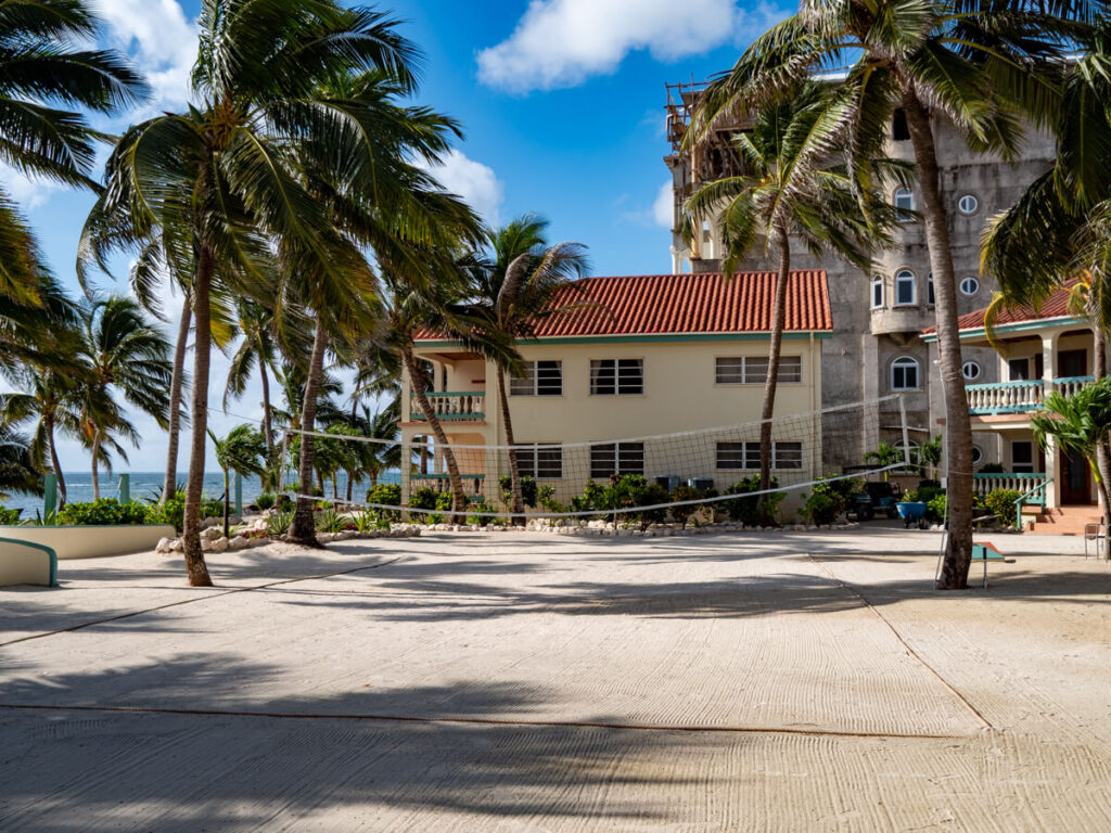 The outside Volleyball Court at Belizean Shores Resort. The net has been fixed between two palm trees.