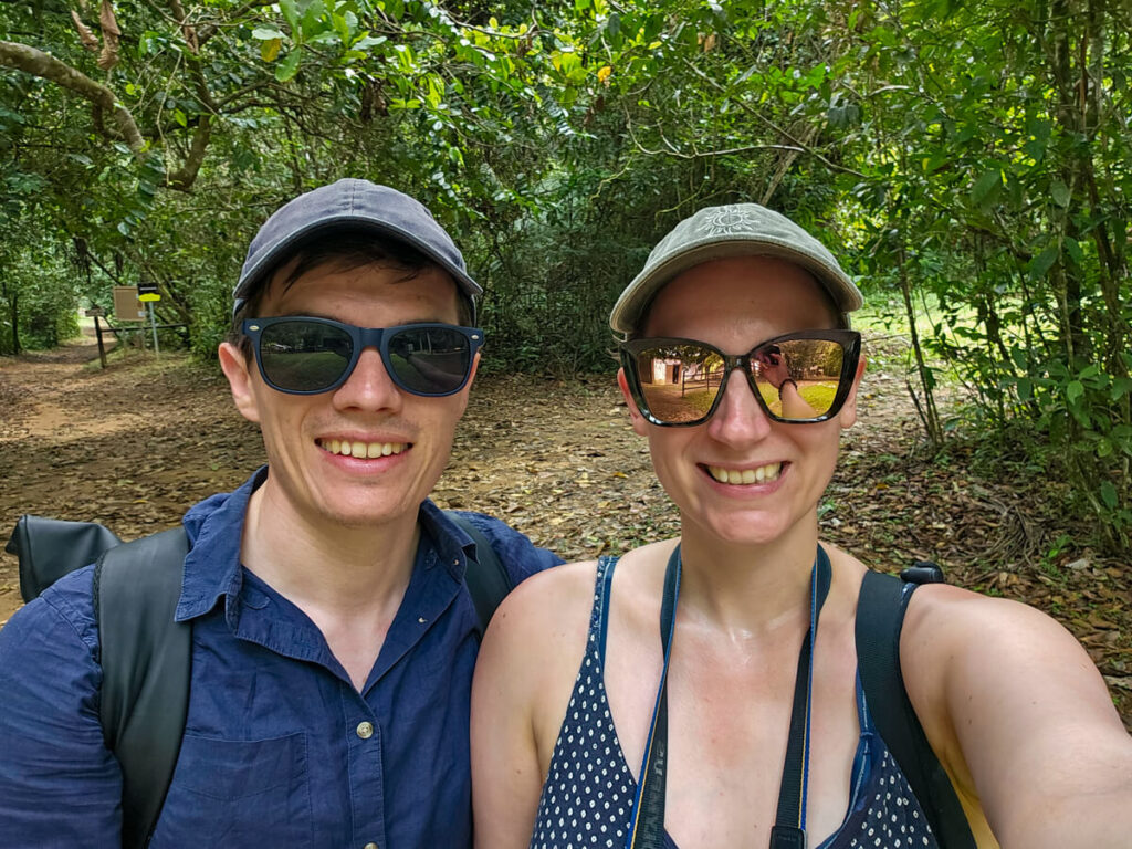 Dan and Lucy smiling at the camera while hiking in Cockscomb Basin Wildlife Sanctuary.