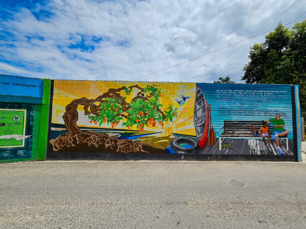 A colourful mural of a tree on a wall in San Ignacio.