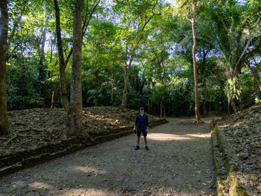 Dan standing in an ancient Mayan ballcourt at Cahal Pech.