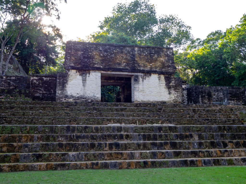 A painted doorway at the top of a stone stairway at Cahal Pech.