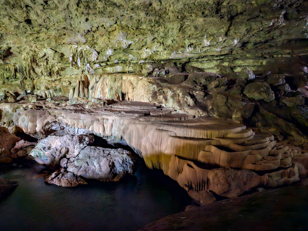 Incredible natural formations, stalactites, and stalagmites in a camber in Rio Frio Cave in the Mountain Pine Ridge Forest Reserve.