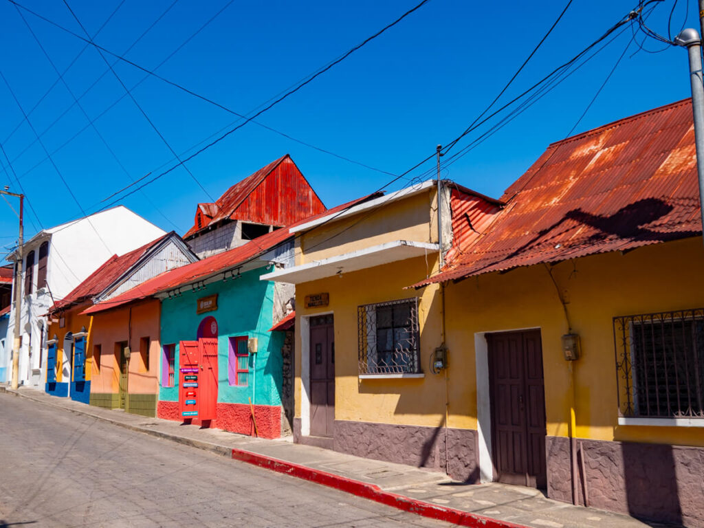 Colourful houses on a sloped street in Flores, Guatemala.