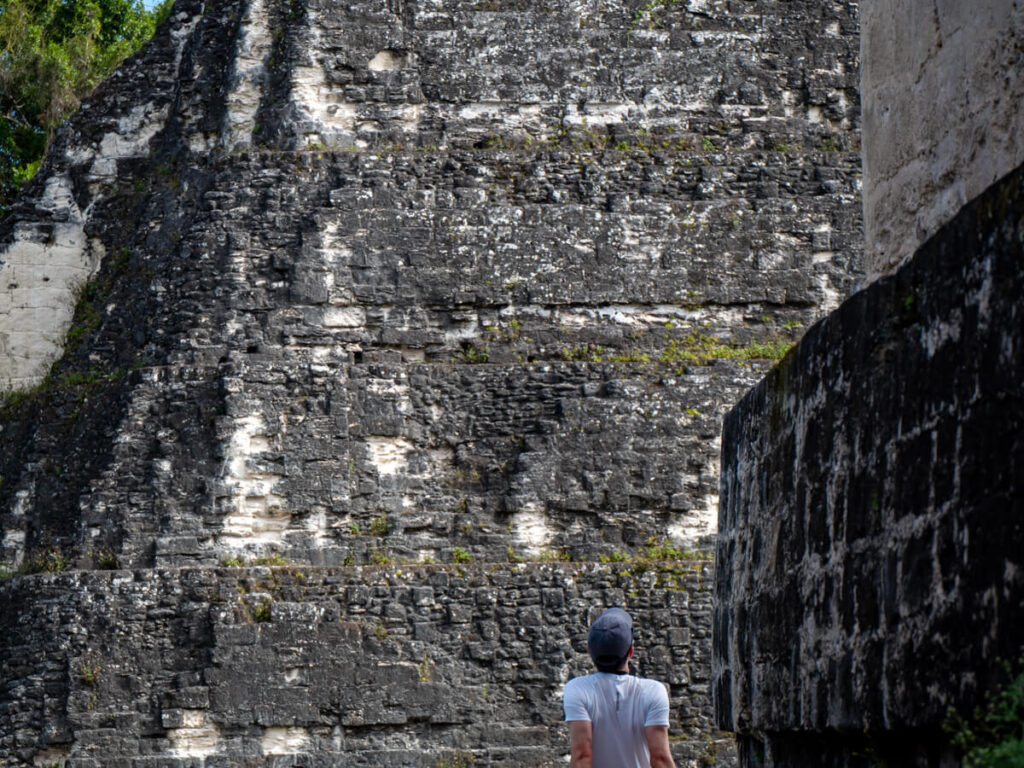 Dan looking at a Mayan pyramid on a tour in Tikal.