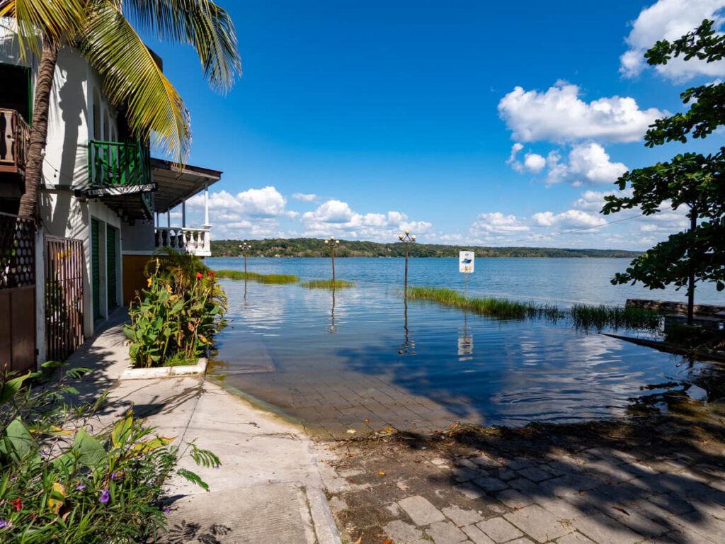 The partially flooded malecón viewed from a lakefront restaurant in Flores, Guatemala.