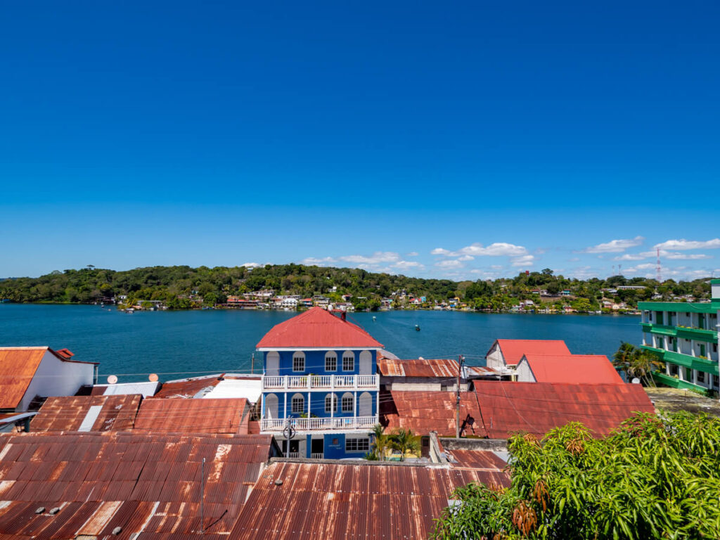 Red roofs of hotels in Flores in front of Lake Peten Itza.