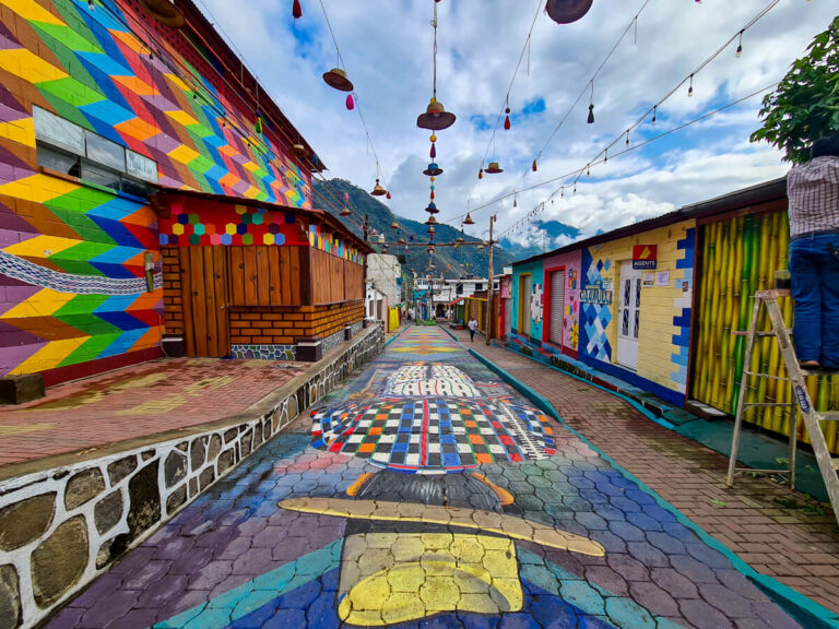 A colourfully painted street with murals on the walls and floor in San Juan La Laguna, Lake Atitlán, Guatemala.