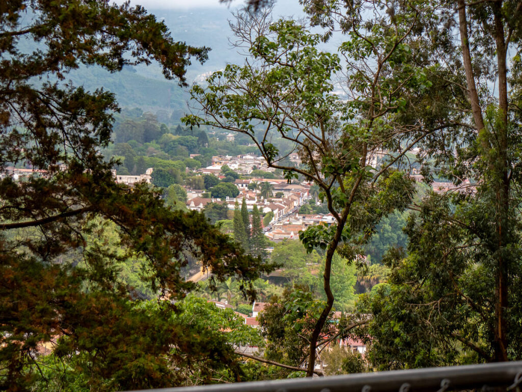 Antigua peeking through the trees on the Cerro de la Cruz hike.